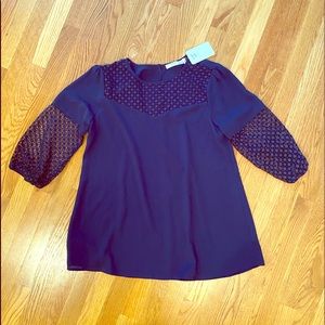 Women’s blouse with detail sleeves and neck line